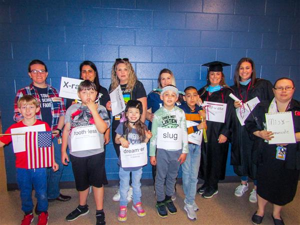 Students and teachers dressing up for a vocabulary parade. 